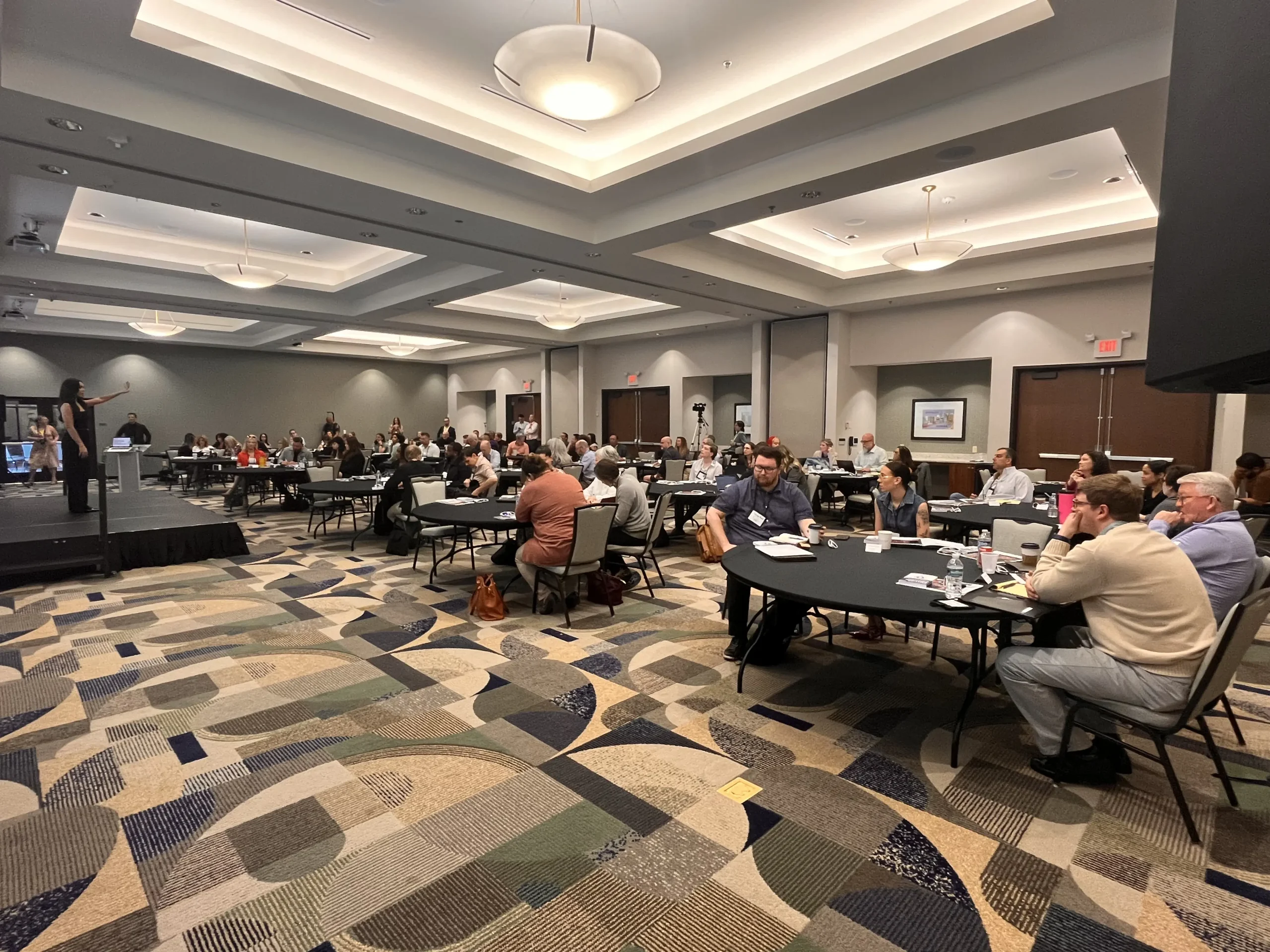 A full room of attendees at the Summit